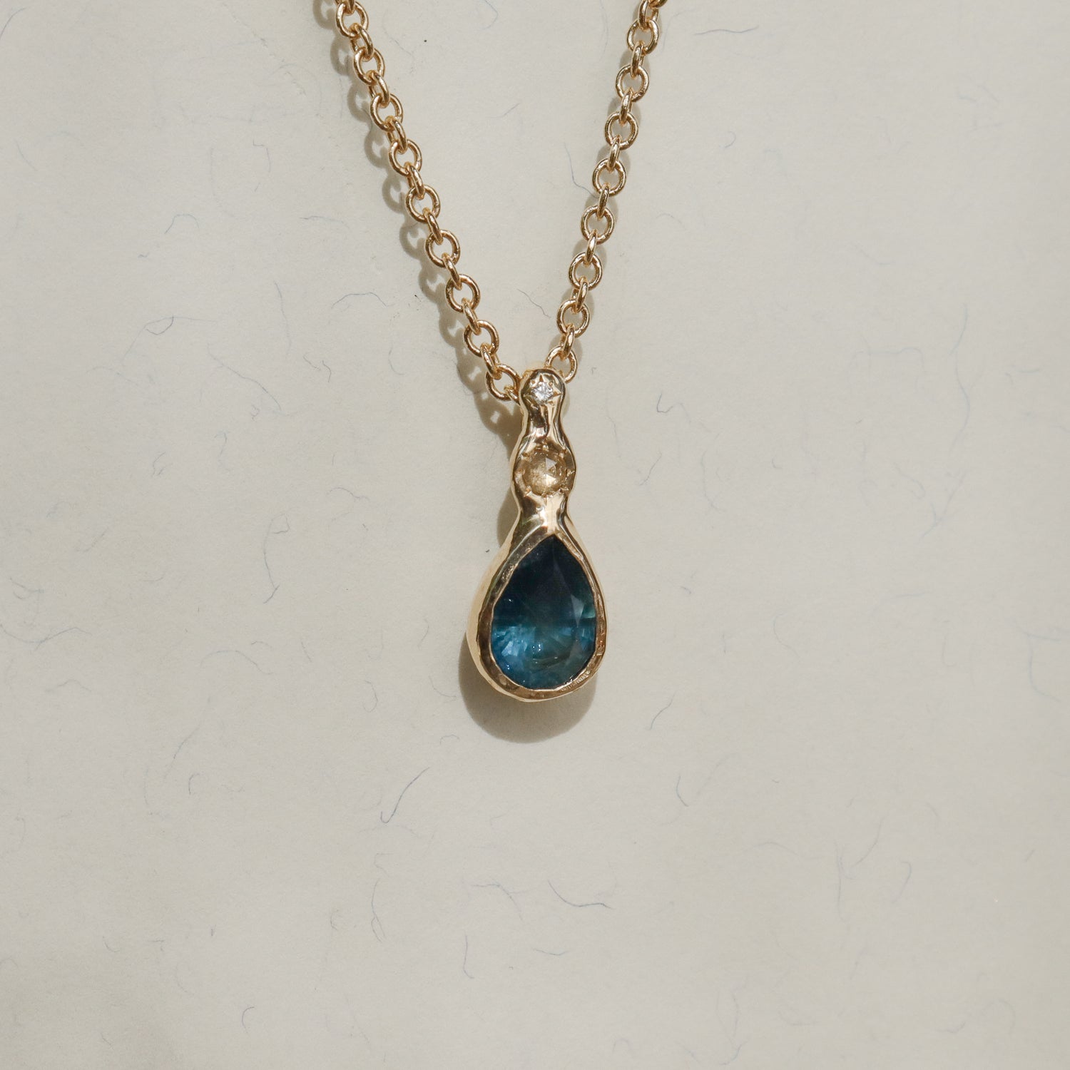 Daughter of the Tide | Droplet Charm, Dark Blue Montana Sapphire, Diamonds, 14k Gold
