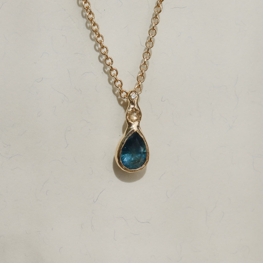 Daughter of the Tide | Droplet Charm, Dark Blue Montana Sapphire, Diamonds, 14k Gold