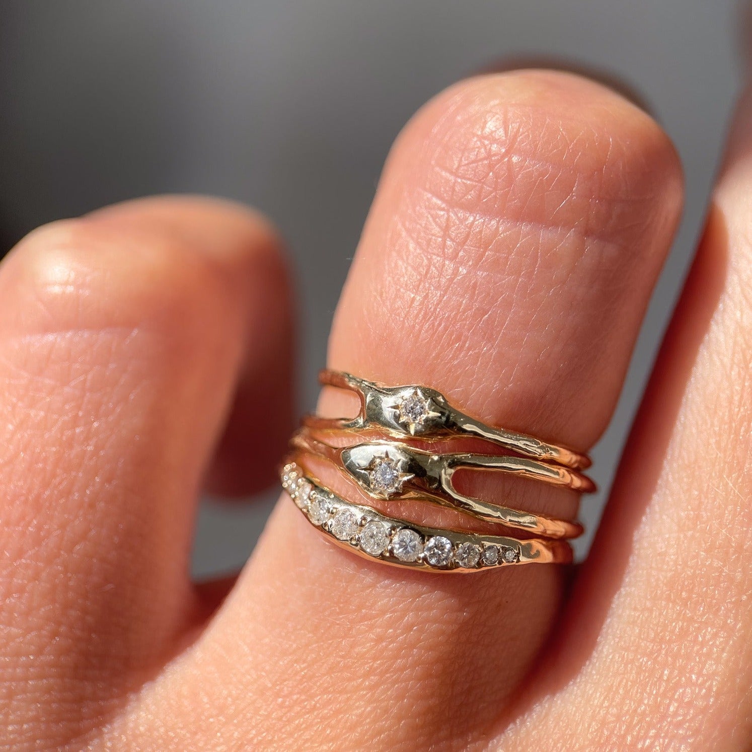 Layered asymmetrical diamond rings.