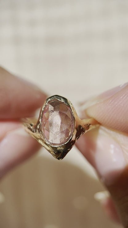 close up video of a rose cut pink tourmaline ring in gold