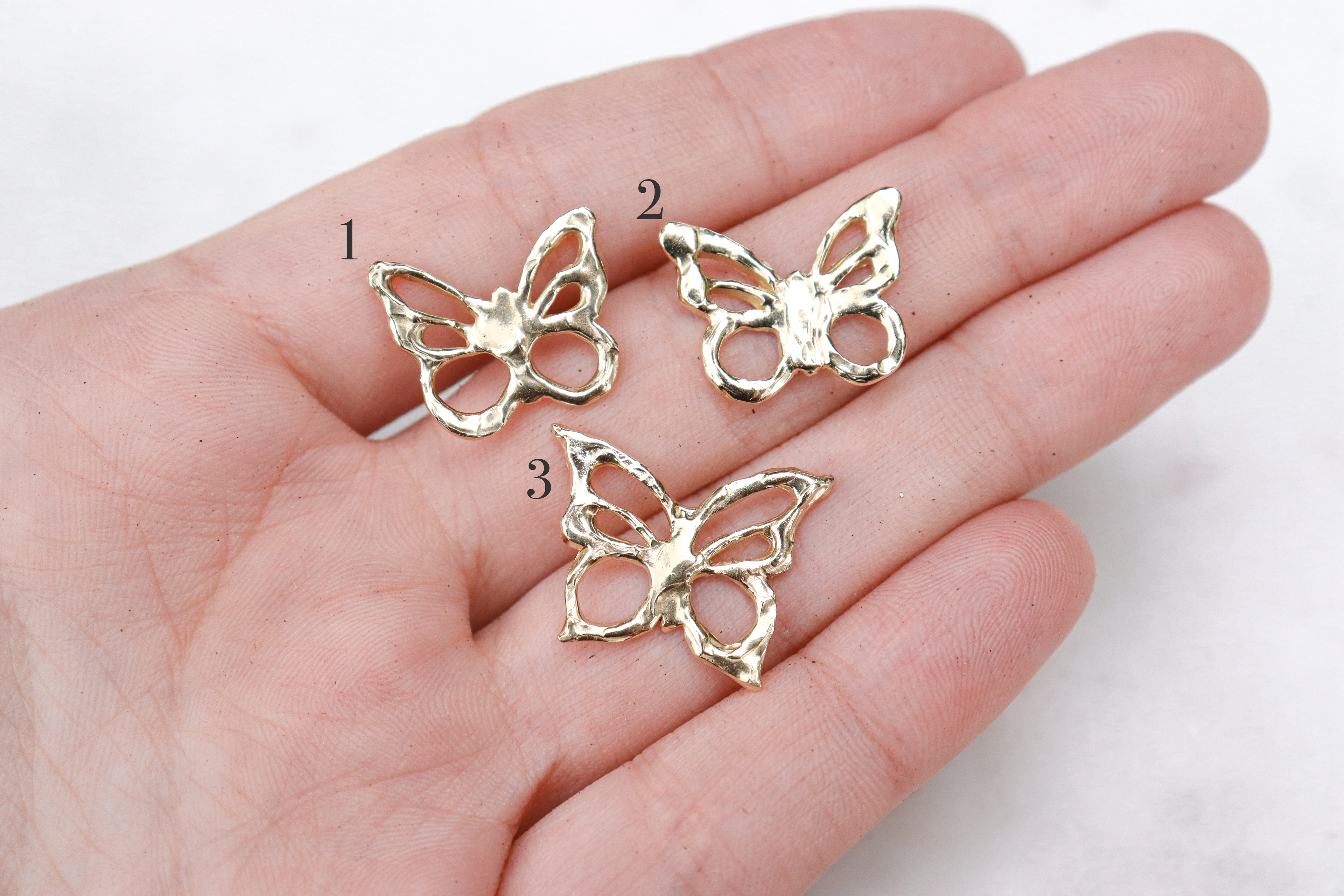 One of a kind butterfly charms made out of 14k yellow gold