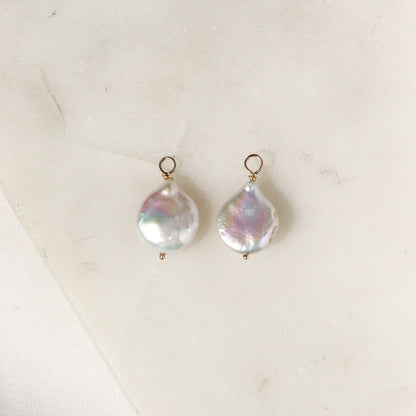 Baroque pearl hoop charms on a white background