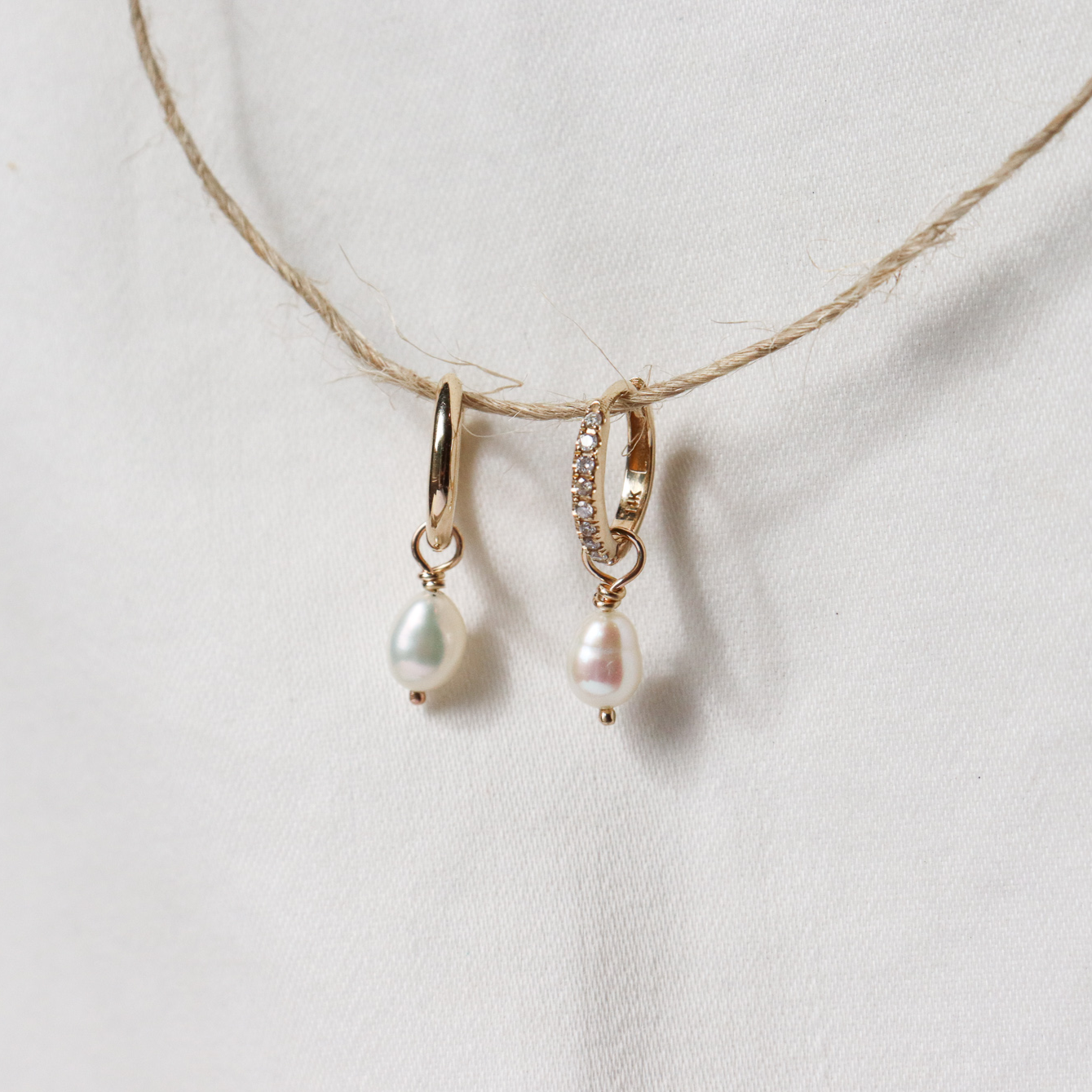 Tiny pearl hoop charms on gold hoops