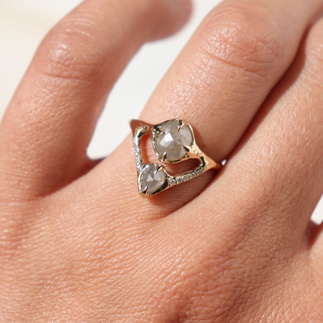 gray salt and pepper diamond ring being worn on the ring finger