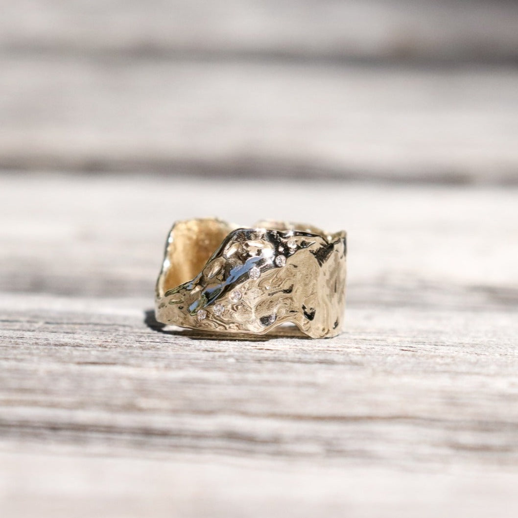 wide gold band with diamonds set along the side