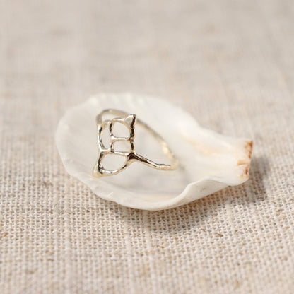Intricate sea shell ring design resembling a split conch shell, evoking coastal beauty and natural elegance.