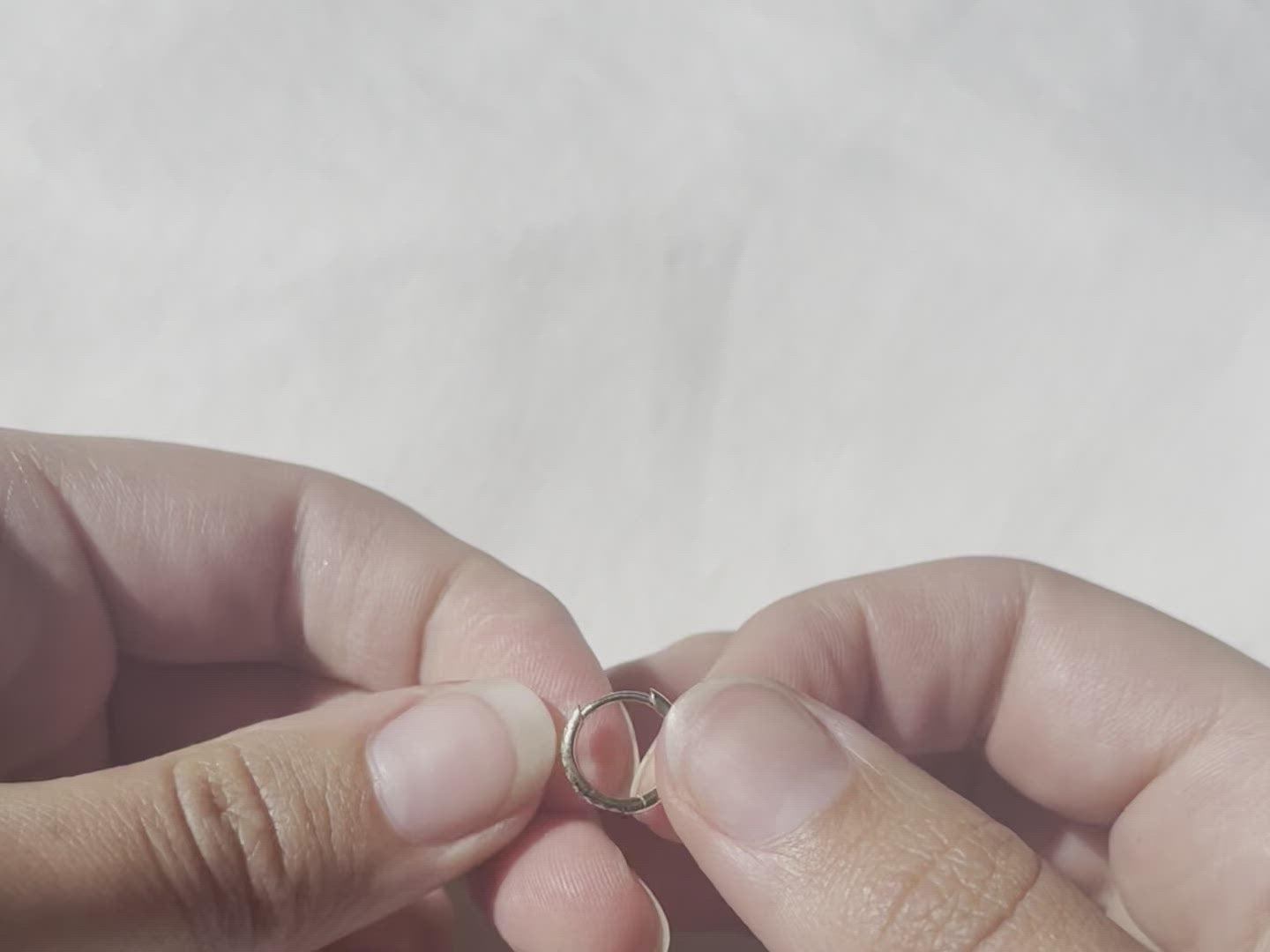 A video demonstrating how the hinge works on the huggie hoops